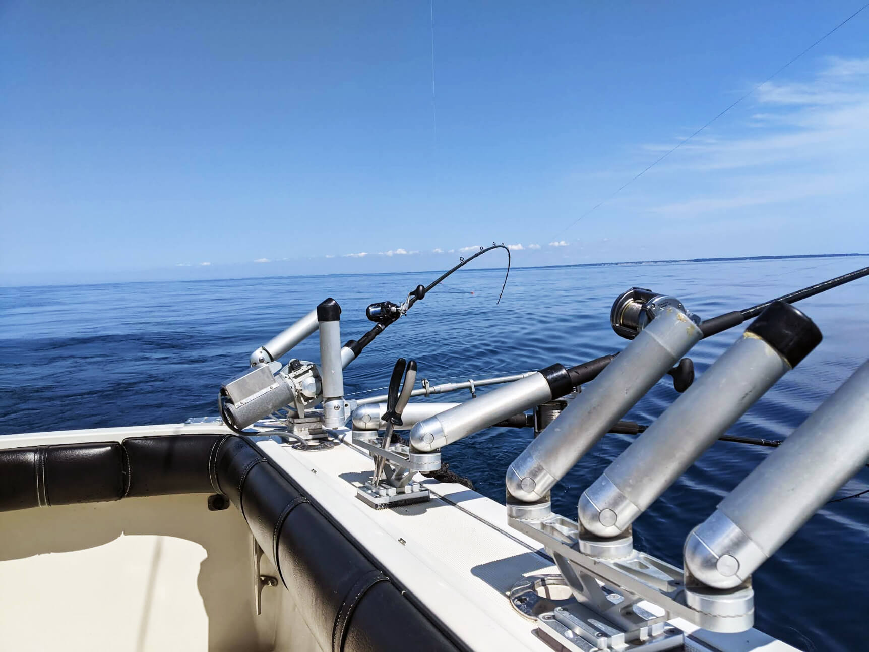 Fishing rods and pole holders on a Sea Hawk charter boat